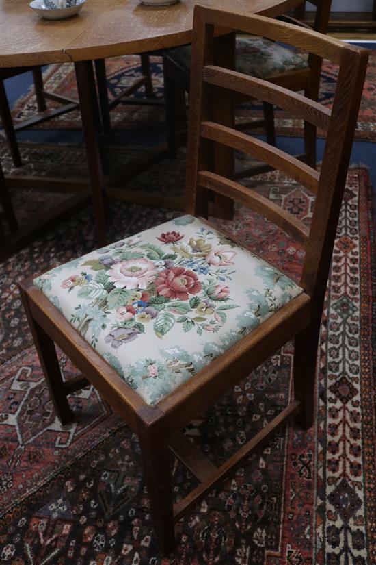 A set of 6 Gordon Russell oak rail back dining chairs